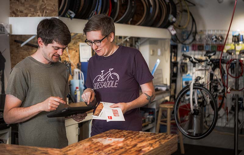 Bike shop business owner with tablet